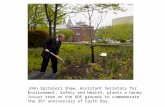 John Spitaleri Shaw, Assistant Secretary for Environment, Safety and Health, plants a honey locust tree on the DOE grounds to commemorate the 35 th anniversary.